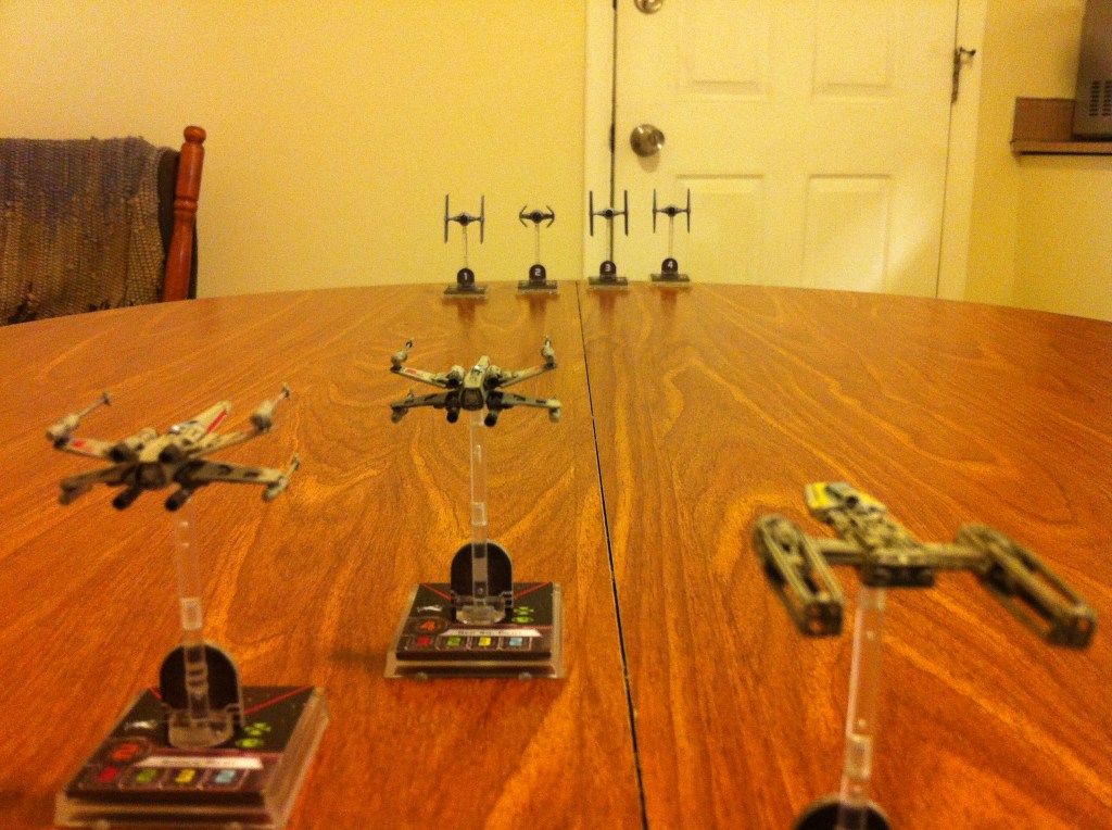 Scout Squadron faces off with four TIE Fighters.