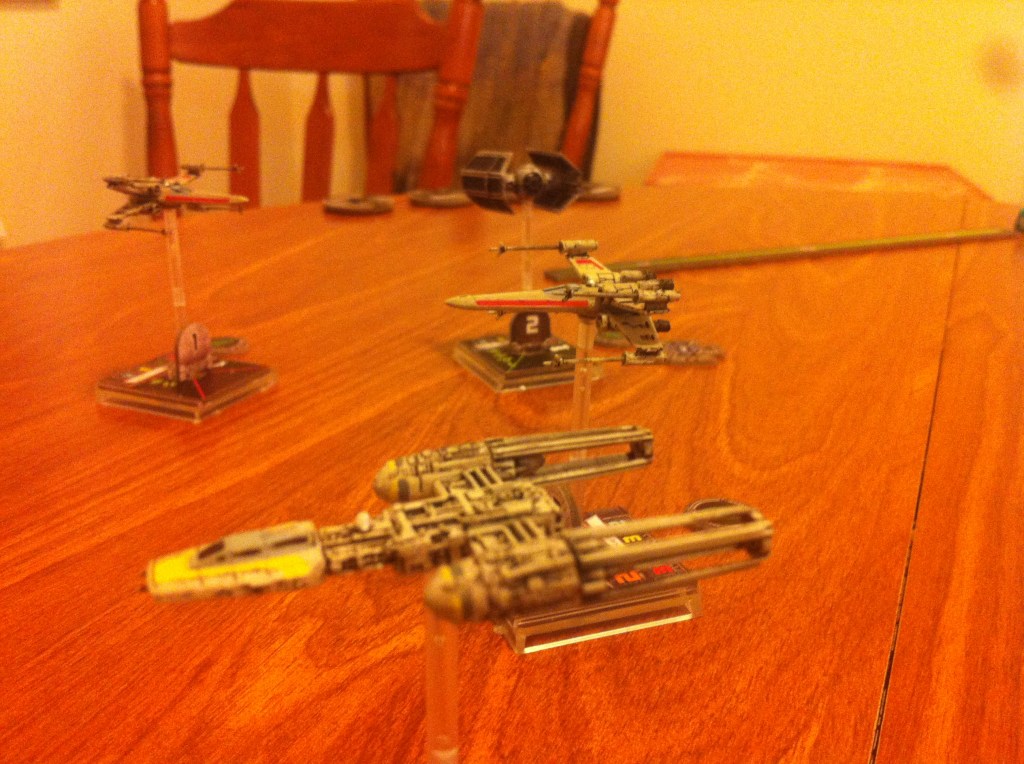 Scout Two protects Scout Three from the incoming TIE Advanced.